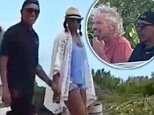 Happy: During day eight of their tropical vacation, the Obamas (above) were carefree and upbeat as they enjoyed the day with their billionaire friend and host Richard Branson in the British Virgin Islands