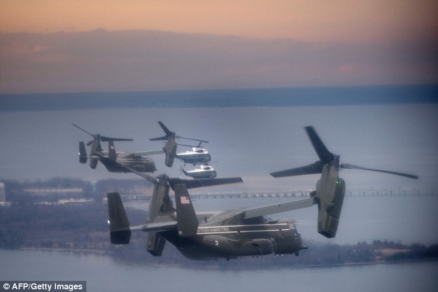 Marine One  flew with a decoy and support helicopters to Dover Air Force 
