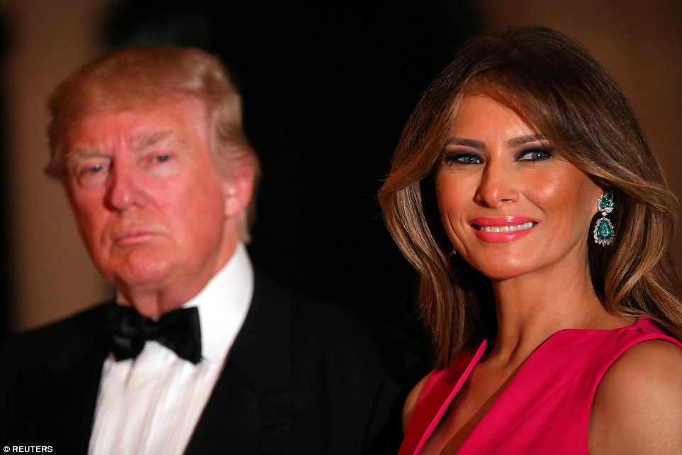 Melania wore a hot pink dress and sparkling teardrop earrings as she accompanied the president to the charity gala. The couple walked room firmly hand in hand, unlike earlier in their Florida trip when Trump is seen 'avoiding holding his wife's hand' 