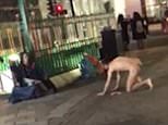 A naked man has been filmed crawling on all fours towards a homeless person outside London's Tottenham Court Road station at around 9pm on Wednesday