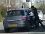 Shocking: Police are hunting for a man  violent filmed beating an Astra driver around the head through his car window (pictured)