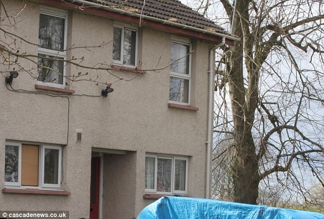 Baker and his wife Caroline, 54, kept the woan in this 'house of horrors', which was two terraced homes knocked into one in Craigavon, County Armagh