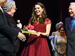 LONDON, ENGLAND - APRIL 04:  Catherine, Duchess of Cambridge, accepts a gift of tap shoes from producers Michael Linnet, Michael Grade and director Mark Bramble during the Opening Night Royal Gala performance of "42nd Street" in aid of the East Anglia Children's Hospice at the Theatre Royal Drury Lane on April 4, 2017 in London, England.  (Photo by David M. Benett/Dave Benett/Getty Images)