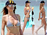 UK CLIENTS MUST CREDIT: AKM-GSI ONLY<BR/>\nEXCLUSIVE: **PREMIUM EXCLUSIVE RATES APPLY** Supermodel Heidi Klum shows off her famous bikini body in the Caribbean. The 43-year-old stunner, was spotted having fun in the sun while on vacation with her four children and mother Erna on Sunday (april 2) in Turks & Caicos. She wore a black and white string bikini and stayed cool under a trucker hat bearing the number '73' - her year of birth - paired with stylish mirrored aviator sunglasses. The group, which included children Leni, Henry, Lou and Johan, enjoyed kayaking and and splashed around in the surf, while Heidi also sipped from a fresh coconut and took a dip in the turquoise waters.\n<P>\nPictured: Heid Klum\n<B>Ref: SPL1473197  040417   EXCLUSIVE</B><BR/>\nPicture by: AKM-GSI / Splash News<BR/>\n</P><P>\n