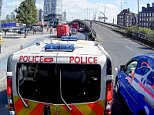 The footage, filmed by Alan Crosby, shows a Metropolitan Police vehicle standing up to a blue van as tries to barge into a slip road in Bow