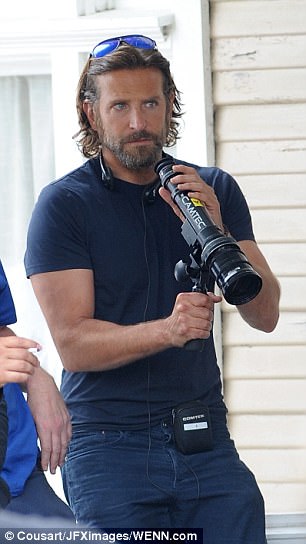 I spy: Bradley was spotted playing around with a telescope on set