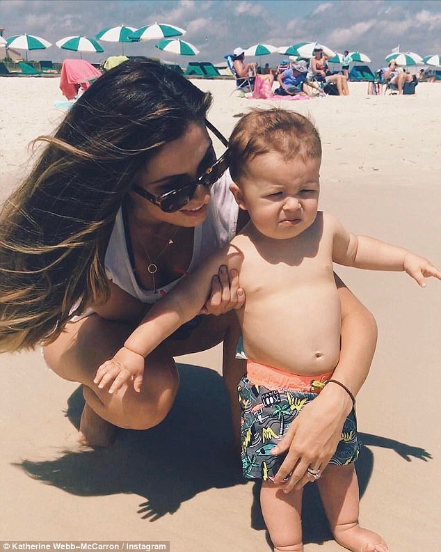 Turn that frown upside down! Katherine Webb shared a hilarious photo of her nearly one-year-old son Tripp grimacing during his second trip to the beach on Tuesday 
