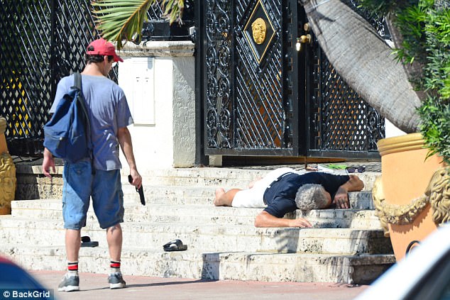 True to life: Edgar Ramirez - who plays Versace - could be seen laying face down on the ground in front of the Italian fashion designer's home: The Vesace Mansion