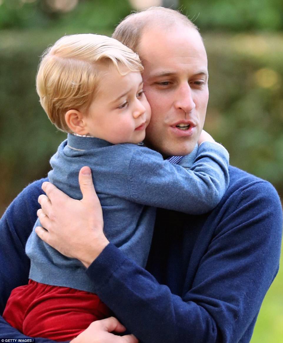 In the second photo posted on the account, Prince William cradles his three-year-old son George tenderly in his arms in a photo taken on the family's tour of Canada last September