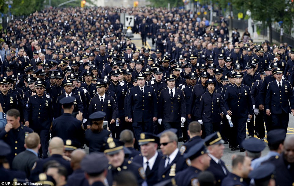 A sea of police officers line up on the Grand Concourse in The Bronx ahead of the Tuesday morning service 