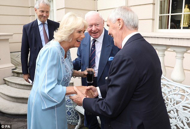 Resplendent in a blue printed dress, Camilla looked radiant as she mingled with her friends at the event