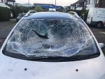 Cars have been vandalised in a street near Luton Airport, including this vehicle which had its windscreen and windows smashed
