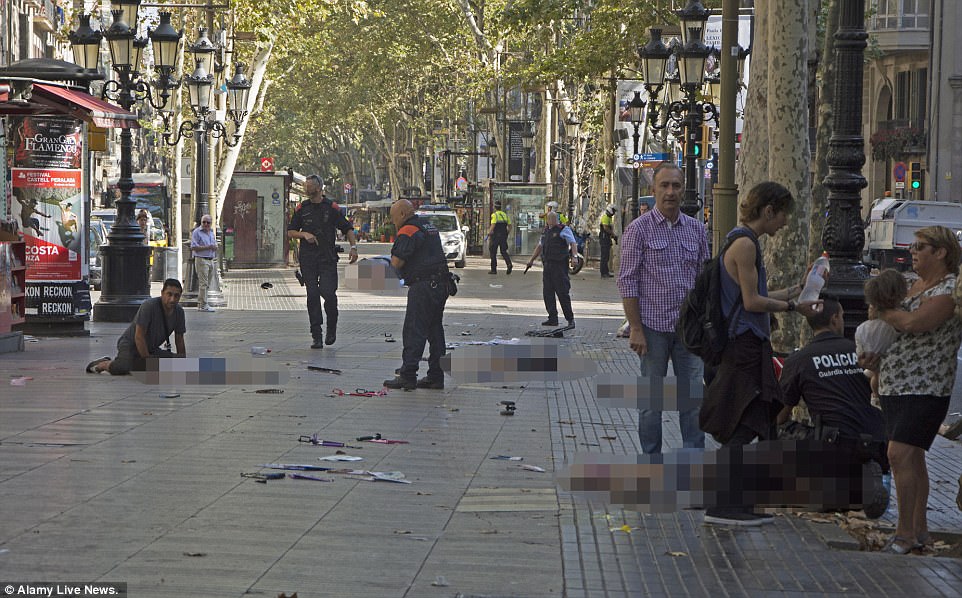 Carnage:&nbsp;Oukabir allegedly took his elder brother&nbsp;Driss's passport and used it to hire a white van driven into crowds of tourists shopping yesterday along Las Ramblas, killing 13 and injuring 100 people.