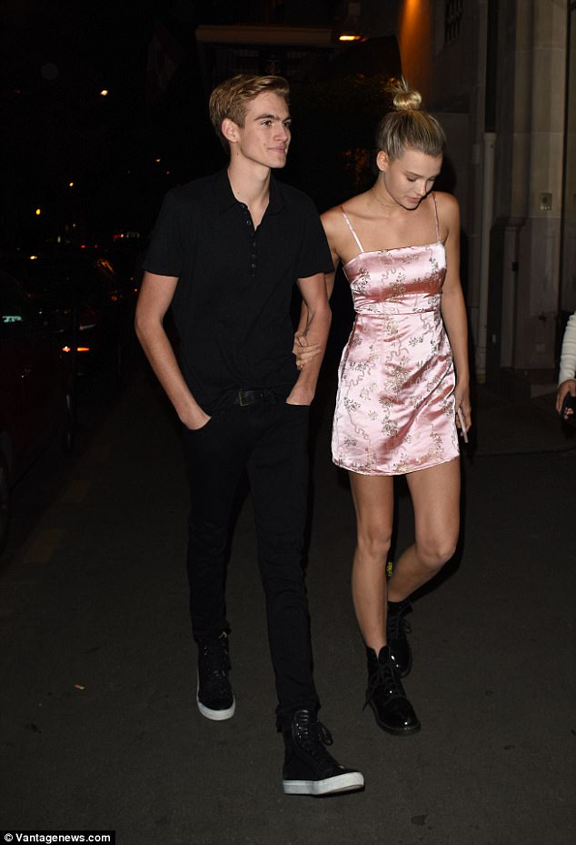 Loved-up: The budding model appeared loved-up with his girlfriend Cayley King, 19, who looked gorgeous in a pink satin mini dress