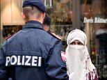A Muslim woman was forced to remove her veil today as the ban on full-face veils came into force in Austria 