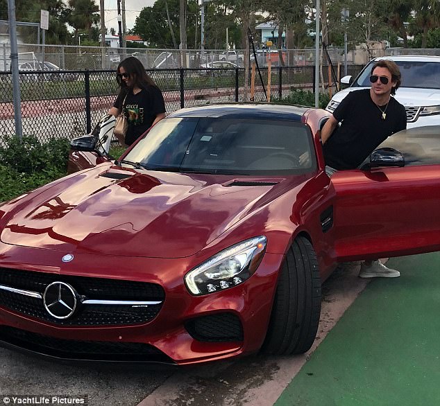 Nice wheels: The two were seen getting out of this $150,000 sports car
