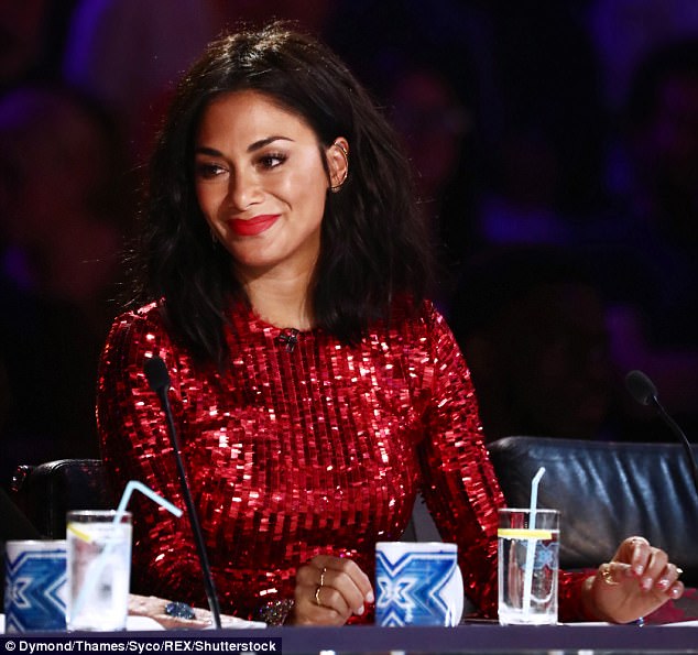 Scarlet siren: Nicole Scherzinger dazzled in a red sequinned dress which clung to her enviable toned figure as she sat at the judging table