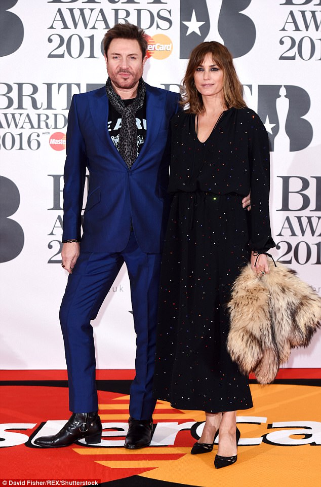 Power couple: Simon and Yasmin were last pictured together at the BRITs in February 2016 - they have been married for 32 years 