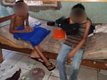 Squalid conditions: The three boys and two girls aged between six and 14 were rescued from their gruesome confinement in a locked room in Cuiaba, central west Brazil, on Friday after begging neighbours to help them escape