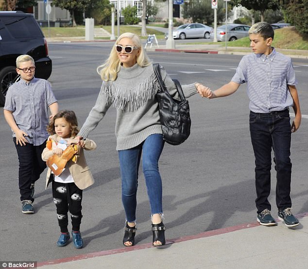 The Lord's day: Gwen Stefani was photographed this Sunday heading to church services in Los Angeles with her sons Kingston, 11, Zuma, nine, and Apollo, three