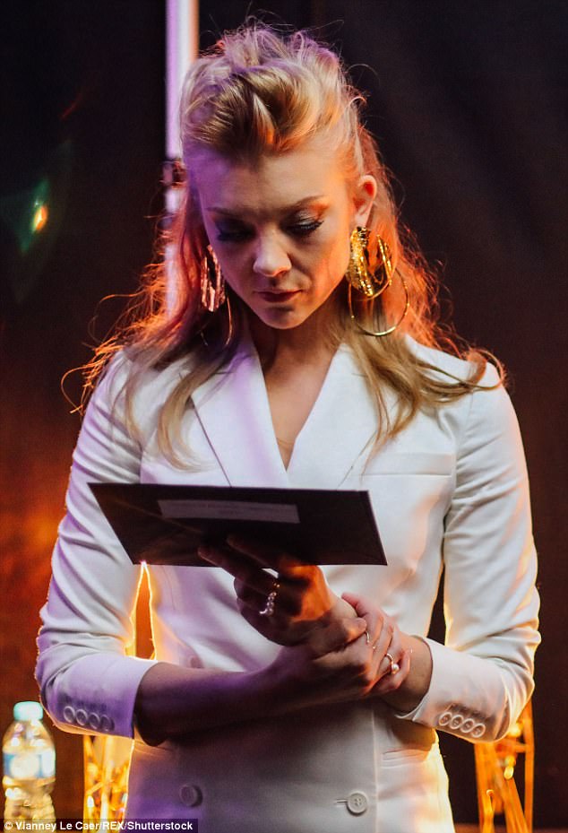 Concentration: Natalie looked focused as she read her envelope before taking to the stage