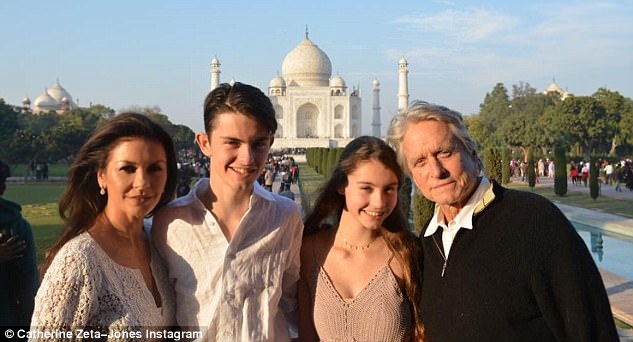 Family trip: Catherine Zeta-Jones enjoyed a picture-perfect moment with husband Michael Douglas, 73, and their children Dylan, 17, and Carys, 14, at India's Taj Mahal on Tuesday
