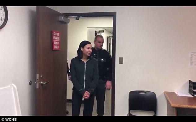 Handcuffed: Naya was arrested and charged with domestic battery, and then taken to Kanawha County Magistrate Court where she was arraigned and a bond was set