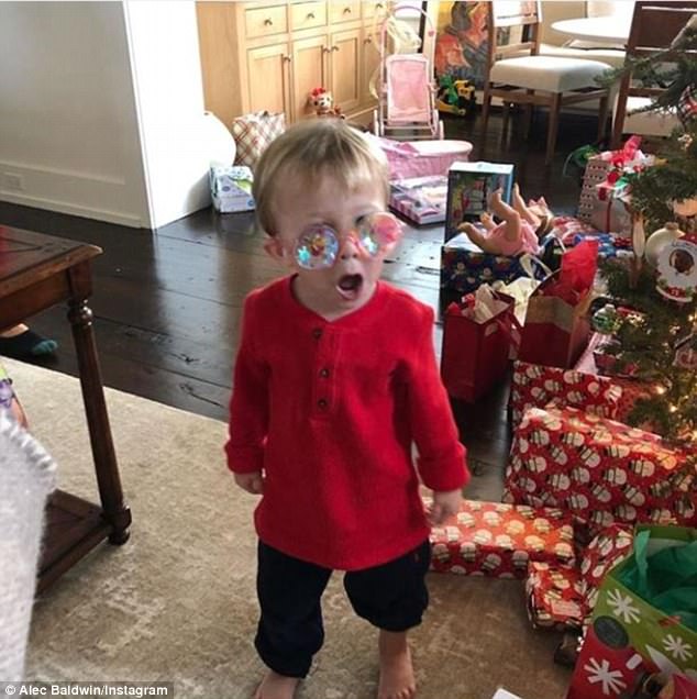 Shades: SNL's resident Donald Trump impersonator and father-of-four Alec Baldwin shared a Christmas morning snap of his two-year-old son Rafael finding his 'inner Elton John'