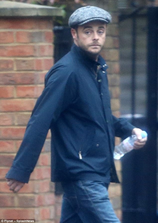 Flying solo: A downcast Ant McPartlin was spotted heading to his home town of Newcastle for Christmas on Friday - without his wife Lisa Armstrong