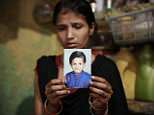 Purshotam Kumar, seven, (pictured with his parents) was brutally murdered and mutilated in a Delhi slum as he tried to fight off a child rapist