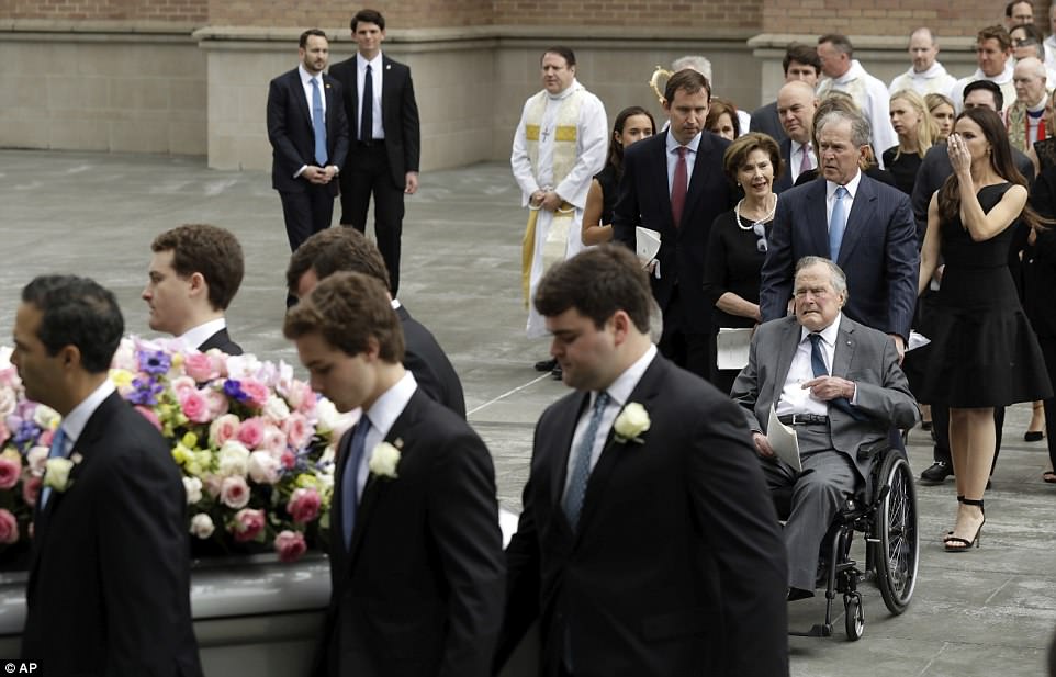 Final farewell: The Bush family says goodbye as the family matriarch is taken from the church and headed to her burial plot