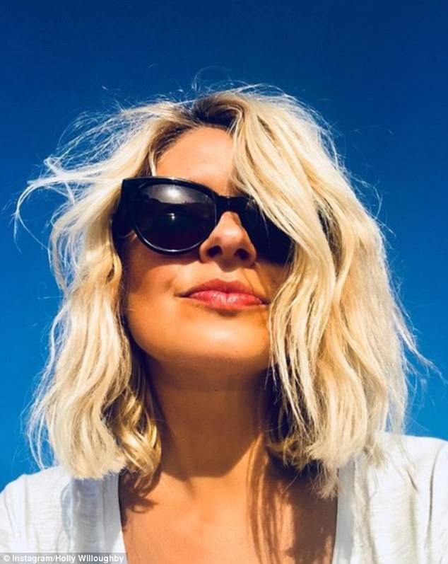 Blonde bombshell: The blonde beauty didn't disappoint as showed off her famous blonde locks in a more tousled style in an Instagram snap on Saturday