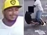 The suspect winds up to punch the 37-year-old in the middle of the street, with the suspect's friend looking on 