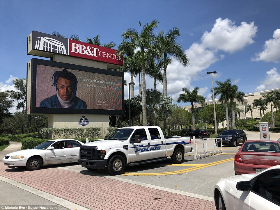 A billboard outside slain rapper XXXTentacion's memorial service in Florida 