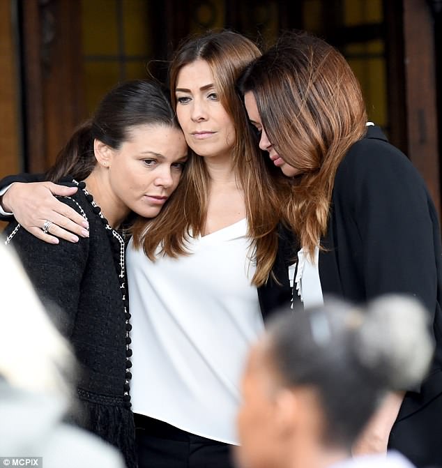 Emotional: Alongside star Kym Marsh (middle as Michelle Connor) the family were seen hugging after saying goodbye to Aidan, as the chaotic fallout of his death continues