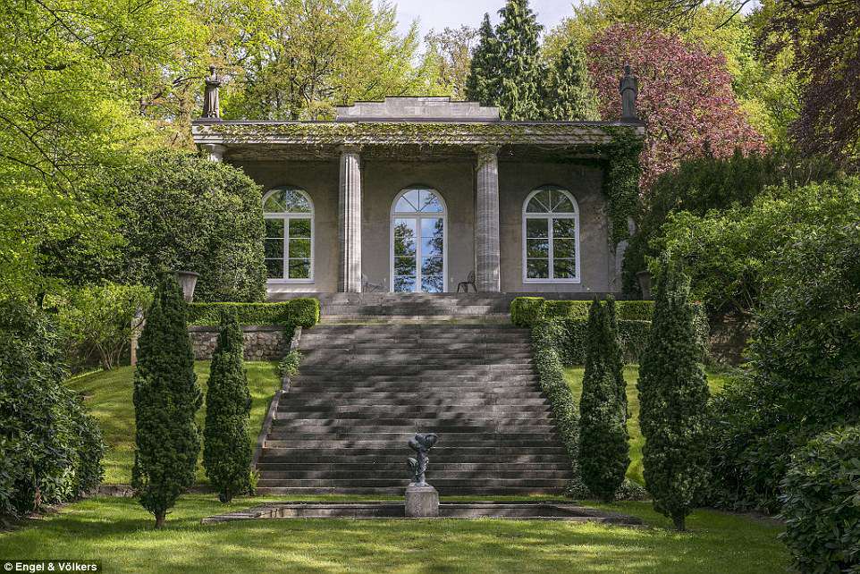 The secluded villa is hidden up a narrow path surrounded by meticulously placed trees overlooking the Elbe river and is held in place by Roman inspired columns. Karl reportedly purchased the property for around 3 million Deutsche marks (£13,000) 