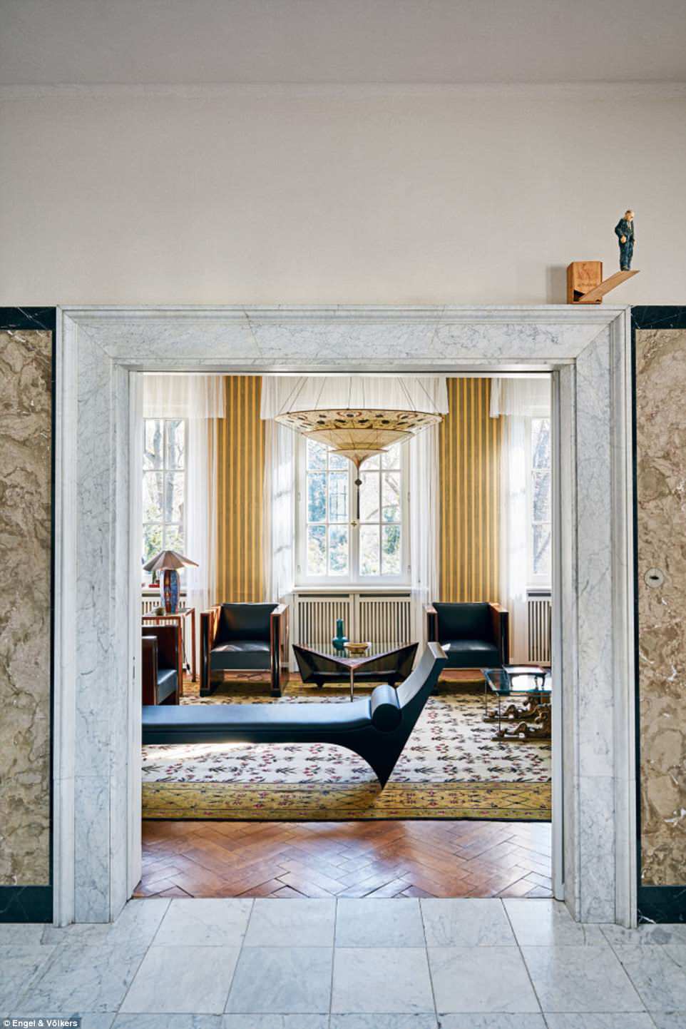 Marble and modern art create juxtaposed styles throughout the lavish property. The atrium leads to the Chinese salon (pictured). Three bedrooms, with adjoining bathrooms and a dressing room, are grouped around an open gallery, which forms the space between the skylight and the atrium