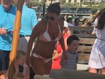 Coleen Rooney, Holly Willoughby and Peter Jones have all been spotted enjoying the same trendy beach restaurant in the Algarve. Coleen looked amazing in an orange and white striped bikini, showing off her enviable figure just five months after she gave birth to her fourth son