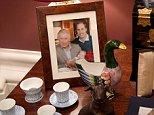 The Prince of Wales has recreated the look and feel of his home for the centrepiece exhibition of the summer opening of Buckingham Palace. Among the items on display is a family photo of Charles holding his first grandchild, Prince George, with the Duke of Cambridge beside him. (To the right is an 18th century Japanese-style bureau cabinet)