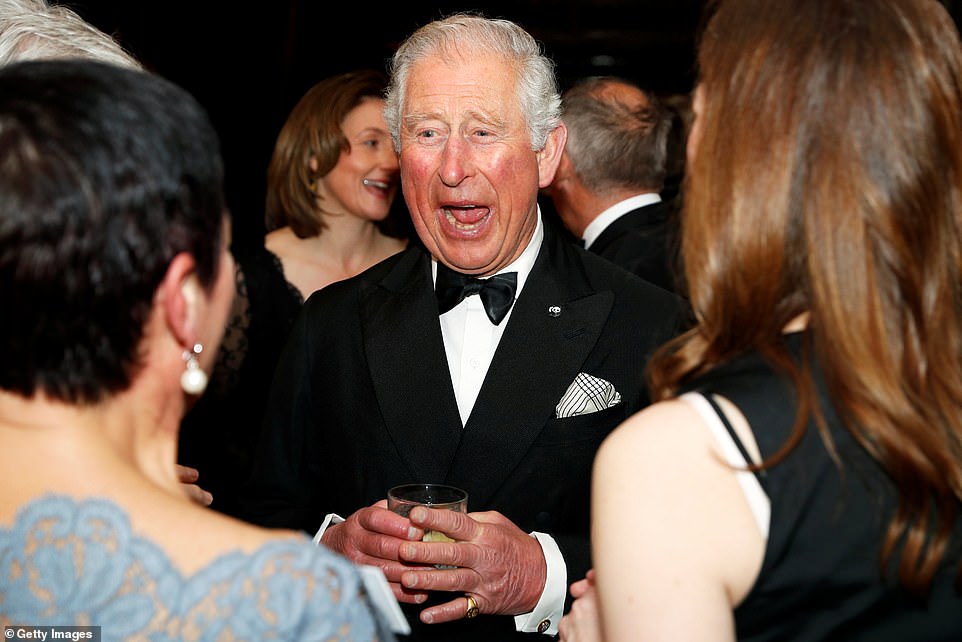 The Prince of Wales laughs with guests at the Natural History museum tonight, before they watch a preview of the new series tonight