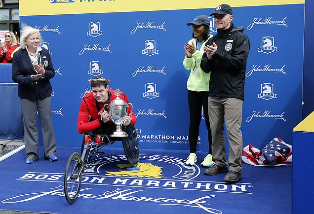Boston Marathon gaffe prompts apology after American flag tossed onto the ground during