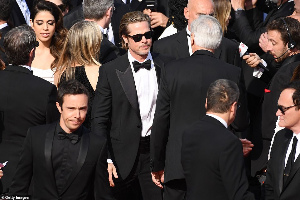 Star of the show: Brad was looking extremely suave as he rocked a tuxedo and stylish sunglasses