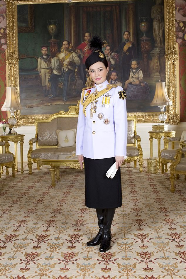 Queen Suthida's heeled black leather boots get another outing for this outfit - this time it's a white military jacket and black skirt