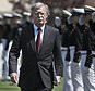 National Security Adviser John Bolton is saluted as he arrives to speak at the commencement for the United States Coast Guard Academy in New London, Conn., Wednesday, May 22, 2019. (AP Photo/Jessica Hill)