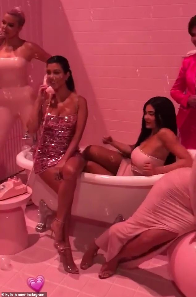 Bathroom scene: The cosmetics billionaire posted a short video of a bathroom photo shoot featuring her sisters Khloé, Kourtney and Kim Kardashian, as well as her mother Kris Jenner