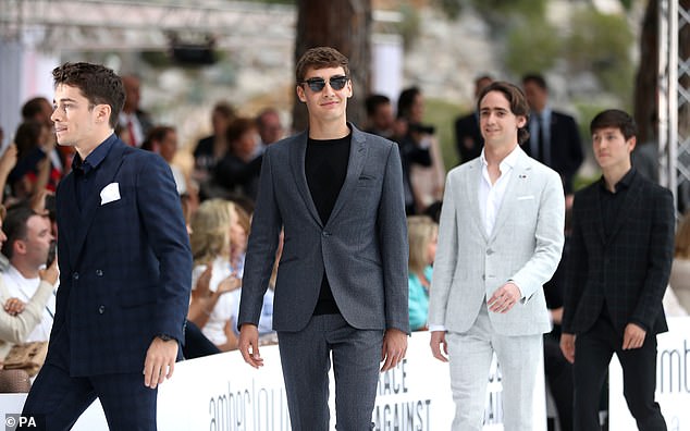 Here come the boys: Formula One drivers Charles Leclerc (left), George Russell (centre), and Esteban Ocon (right) were putting in an appearance