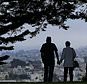 FILE - In this July 3, 2017 file photo, a man and woman walk under trees down a path at Alta Plaza Park in San Francisco. Data from the U.S. Census Bureau shows the median age in the U.S has increased by a year to 38.2 years from 2010 to 2018. The date released Thursday, June 20, 2019, comes as many baby boomers have been hitting the retirement age in recent years.  (AP Photo/Jeff Chiu, File)