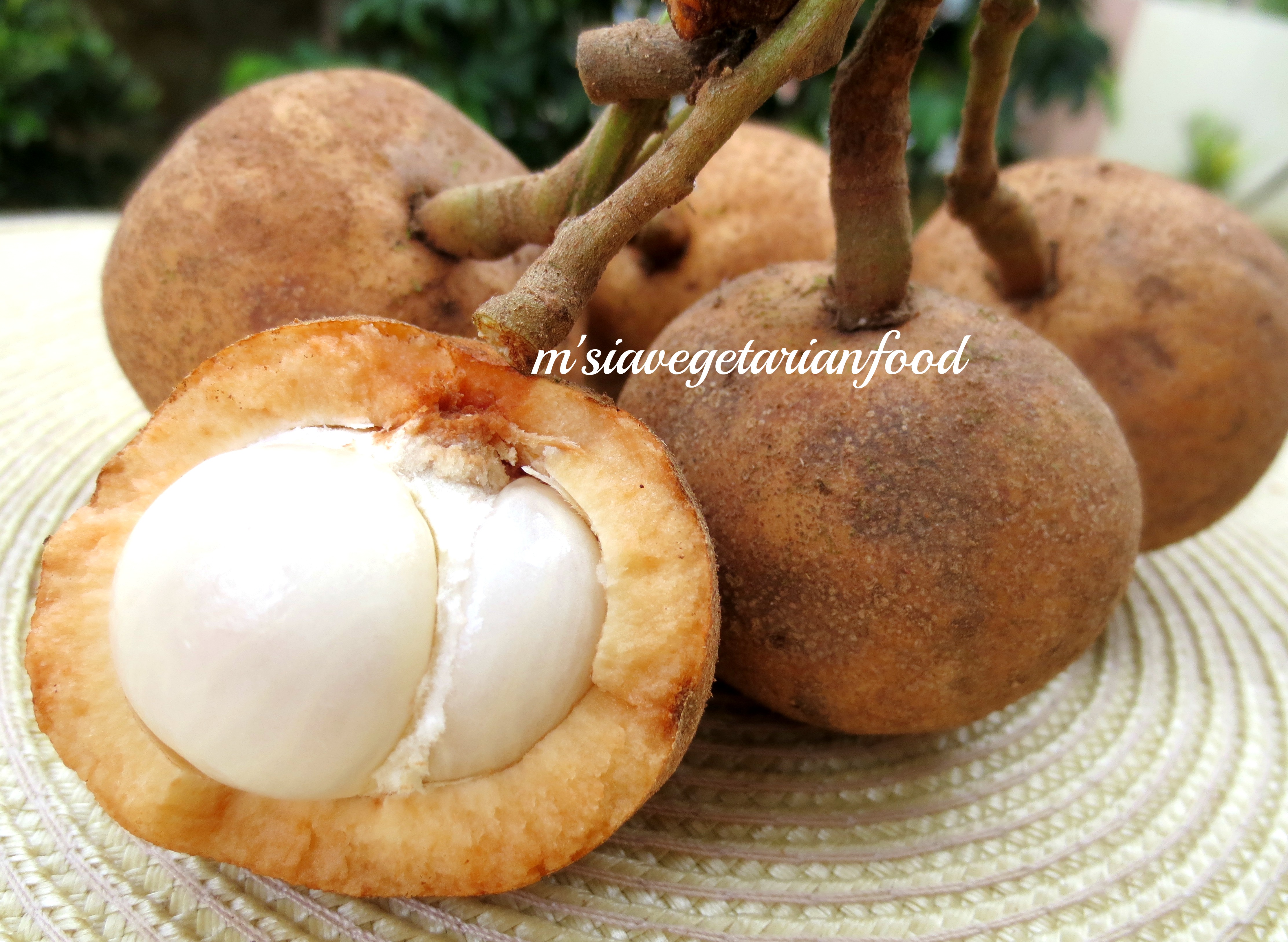 Tampoi in orange brownish skin with pearly white pulp