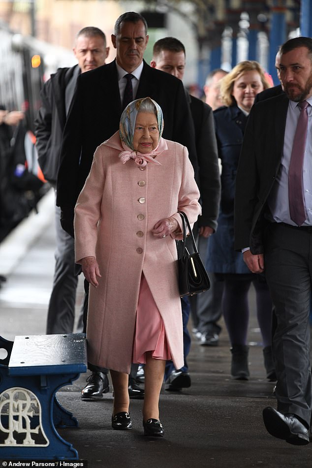 The Queen, pictured centre left, started her official Christmas holiday yesterday arriving at Kings Lynn station on the Royal Train, shortly before her husband was airlifted to hospital
