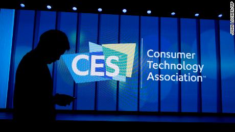 A person walks past a sign at a Samsung keynote before the CES tech show, Monday, Jan. 6, 2020, in Las Vegas. (AP Photo/John Locher)